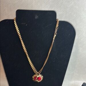 Elegant Gold Necklace with Red Gemstone